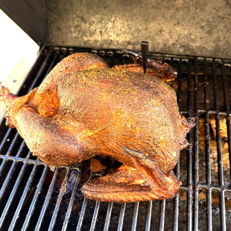 Whole smoked turkey on the grill